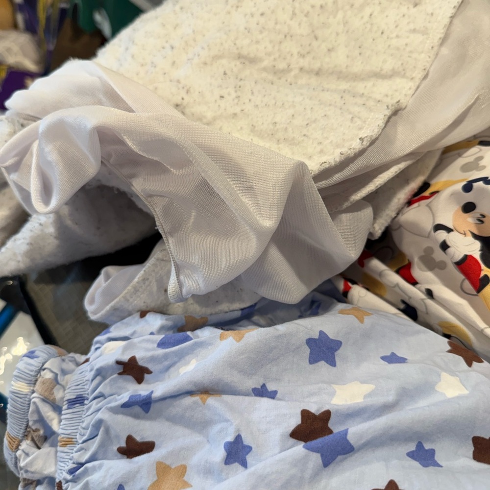 Light Blue Star Print and a Mickey crib sheet and on mattress pad